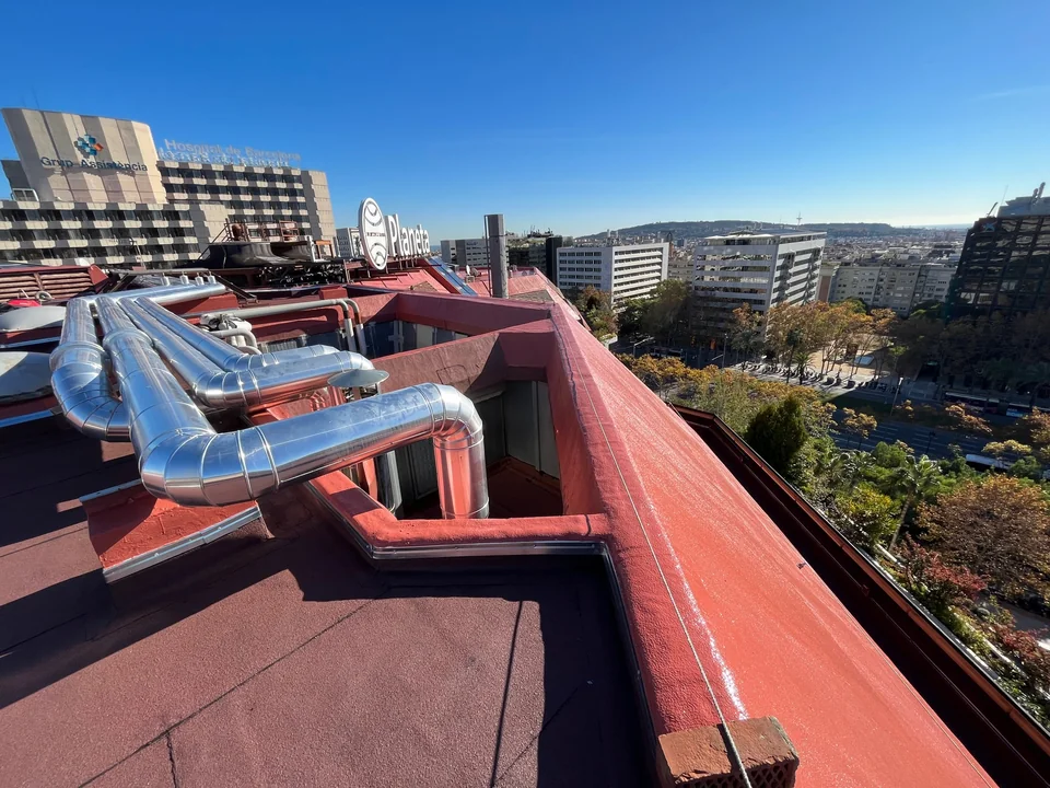 Existing rooftop with waterproofed surfaces around building services